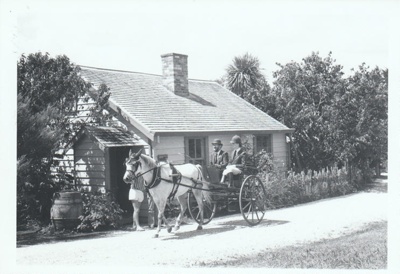 A horse and cart outside Briody-McDaniel cottage on Church Street in Howick Historical Village.; La Roche, Alan; 27 February 1988; P2021.180.04