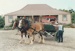 Christmas, past and present at Howick Historical Village, 12 December 1987. Showin the wagon parked in front of Brindle cottage.; Smith, Christina; 12 December 1987; P2021.195.07