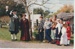 Ron Fryer, as the Town Crier and his wife Irene with "urchins" looking on.; c1990; 2019.132.08