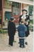 Ron Fryer, as the Town Crier talking with two boys outside Brindle Cottage.; 2019.132.05