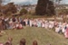 A crowd of people at Howick Historical Village during a Live Day. Children are in costume.; August 1983; P2021.172.05