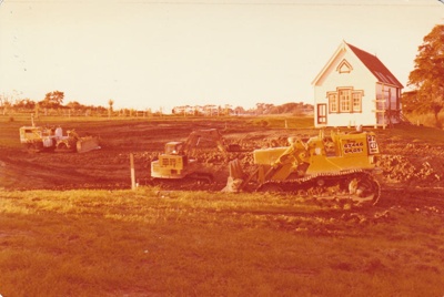 A bulldozer digging out the pond in the Howick Historical Village.; La Roche, Alan; 24 April 1979; P2022.19.02