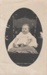 A Wilson baby sitting in a chair.; P2022.57.08