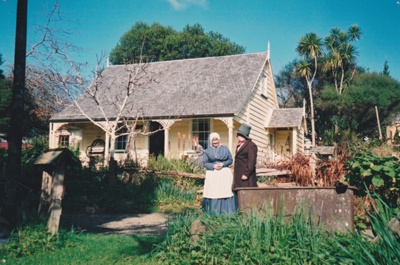Doug White and a woman outside Sergeant Barry's cottage in Howick Historical Village. All in costume.; La Roche, Alan