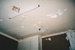 Puhinui's kitchen ceiling in derelict state with a fluorescent light.; Alan La Roche; March 2002; P2020.14.28