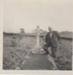 Rev Melville Holmes at the grave of Rev .A.S.Fox; 2018.366.03
