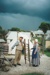 Richard Lees and Barbara Doughty in costume, with a ladder (Irish wheelbarrow) in Howick Historical Village. ; P2021.128.15
