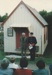 Alan la Roche in military dress, making a speech outside the Dame School at its opening ceremony at Howick Historical Village. Keith Cathie is standing alongside.; 6 May 1990; P2021.62.01