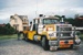 A Truck Towing  and a Johnson's truck moving away after delivering half of Puhinui onto its new site in the Howick Historical Village.; Alan La Roche; May 2002; P2020.11.22