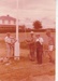 Alan la Roche, David Edwards (obscured), Arthur White. Jack Davis and Glen Taylor erecting the flagpole in Howick Historical Village.; 1980; P2021.114.03