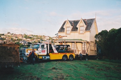 Ace Towing Co. truck in front of Puhinui on its new site in the Howick Historical Village.; Alan La Roche; May 2002; P2021.11.47
