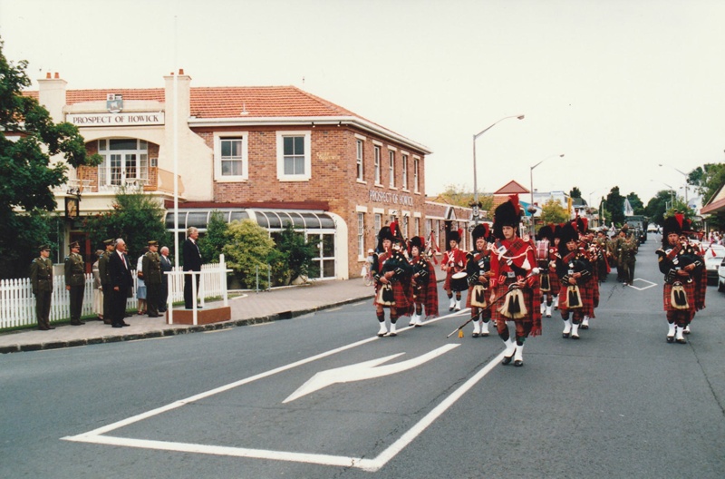 The official party watching the Manukau Pipe Band marching by, outside the Prosp... on NZ Museums