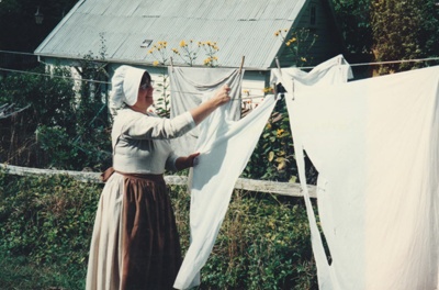 Barbara Doughty pegging out washing on a Live Day at  HHV.; La Roche, Alan; 2019.201.02