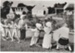 Joy Wesch with children from St Thomas' school playing tug of war  in Howick Historical Village.; N.Z. Herald; 1983; P2021.121.01