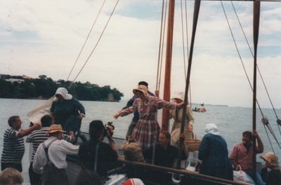 The November 1977 re-enactment of the Fencible and early settler landing at Cockle Bay. Photograph shows Debbie Benson and Marin Burgess as settlers preparing to land.; November 1977; P2021.92.03