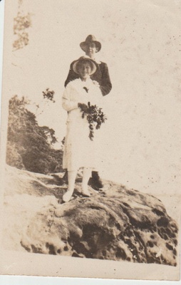 Evelyn and Bert Brickell on cliffs above a beach.; c1920; 2018.311.20