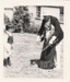 Charles Shipman demonstrating the diablo toy to two children at Howick Historical Village during the 1080 Gala in October 1983.; La Roche, Alan; October 1983; P2021.173.30