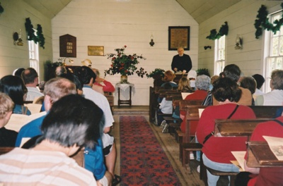 Rev Keith Rowe, Minister taking a service in the Howick Methodist Church in the Howick Historical Village.; La Roche, Alan; P2020.38.06