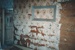 Part of the wallpaper showing a glass frame to preserve it in the living room of the Allenby Rd house which became Sergeant Ford's  cottage at Howick Historical Village.; La Roche, Alan; 1994; P2021.51.02