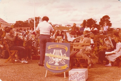 The Howick Auxiliary Band performing on a Live Day in Howick Historical Village.; La Roche, Alan; 23-23 August 1980; P2021.100.19