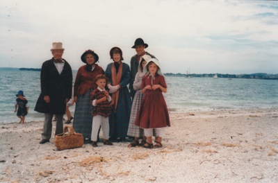 The November 1977 150th re-enactment of the Fencible and early settler landing at Cockle Bay. Photograph shows Malcolm and Christina Smith welcoming the new settlers, played by David Legge and his family.; November 1977; P2021.92.07