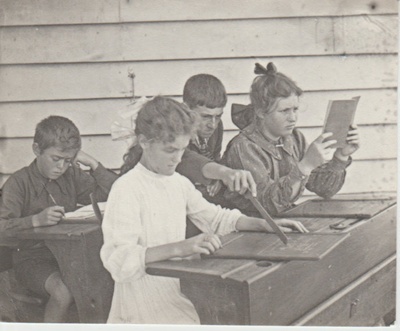 Howick School children sitting at school desks; Judkins, A J T; 1911-1913; 2019.075.04