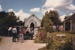 A wedding car and guests outside the church in Howick Historical Village. ; P2021.131.02