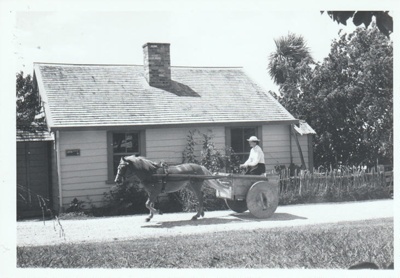 A horse and box cart outside Briody-McDaniel cottage on Church Street in Howick Historical Village.; La Roche, Alan; 27 February 1988; P2021.180.12