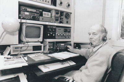 John Litten with his ham radio equipment.; 1988; 2018.377.19
