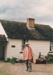 Alan la Roche (in costume) outside Briody-McDaniel Cottage in Howick Historical Village on a Live Day.; Ashby, Frank; 20 September 1992; P2021.118.05