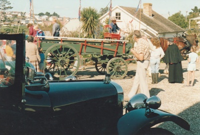 A parade of vintage vehicles on Church Street at the Mayday celebrations at Howick Historical Village.; La Roche, Alan; 3 May 1987; P2021.168.12