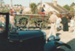 A parade of vintage vehicles on Church Street at the Mayday celebrations at Howick Historical Village.; La Roche, Alan; 3 May 1987; P2021.168.12