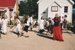 School children and a teacher stilt walking in Howick Historical Village.; La Roche, Alan; P2021.125.02
