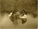 Three girls sitting in water; Edward W Payton; 1917; OP-1775