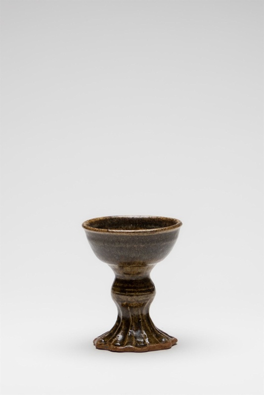 Gothic inspired goblet with fluted and sculptured stem. Molten green glass detail inside cup