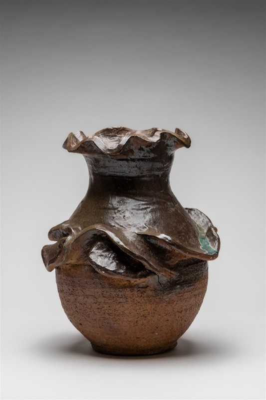An example of a Rust 'Birth Pot' with an undulating mouth depicting growth and metamorphosis from the potter's wheel. 