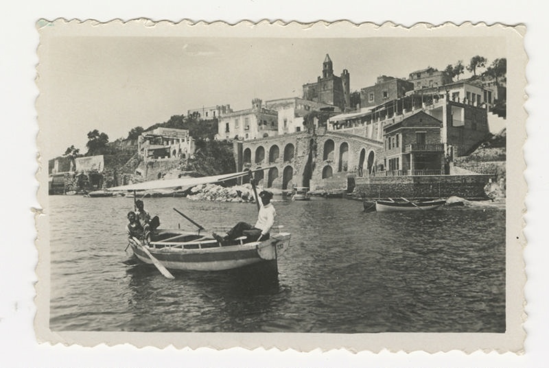 Photograph, Boating scene and ancient buildings.