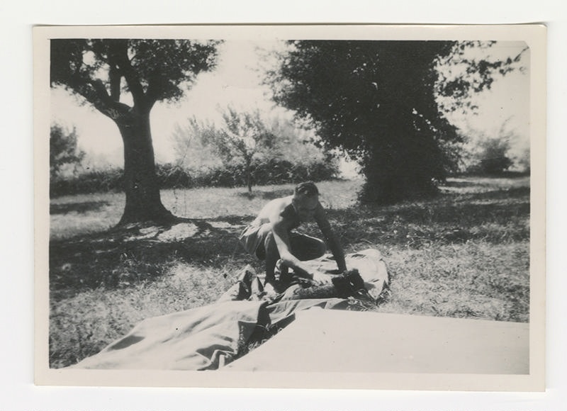 Photograph, Allied soldier setting up camp, World War Two.