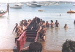 Photo: Waka and paddlers on Russell Beach, c1980's; 97/1681/3