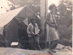 Photo: Two women outside workers camp whare, 1929-30; 97/1450