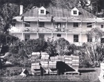 Photo: Pompellier with stack of shingles in the foreground, 1975; 97/1065 Photo: Pompellier with stack of shingles in the foreground, 1975; 97/1065