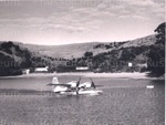 Photo: Edens arriving at Otehei Bay in amphibian with Captain Freddy Ladd, 1957; 97/1533