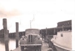 Photo: Car on barge, Opua, c1950's; 97/1223