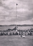 Photo: Waitangi Day showing flagstaff and people; 97/1326