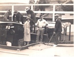 Photo: Duchess of York in cockpit of A.J. Court's launch, Ivan Anderson in white jersey, 1927; 97/1511