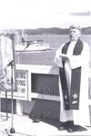 Photo: Rev. Bill Law conducting Sea Sunday Service, Russell wharf, 1996; 97/1545