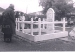 Photo: Laying wreath at "Hazard" grave, Russell churchyard, Kororareka 150th anniversary, 1959; 97/698