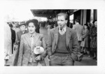 Photo: Pauline and Jim  Yearbury walking down a city street; 1947; 09/108