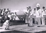 Photo: Queen Elizabeth and girl who has given her flowers, Fiji, 1953; 97/1482