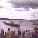 Photo: Canoe and warriors returning to Waitangi, c1970; 99/1497
